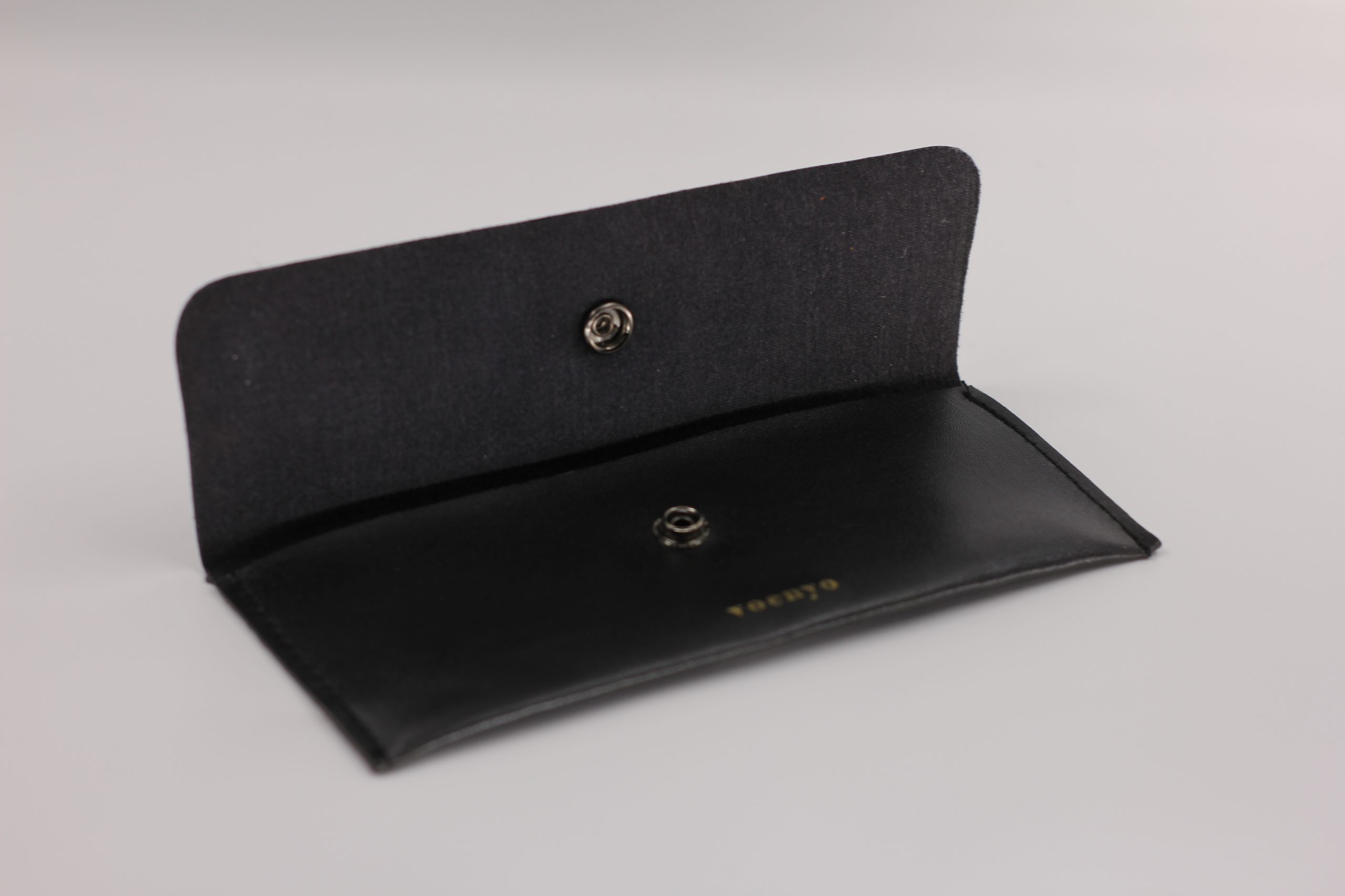 Black leather product packaging bags from Chinese factories, customizable packaging bags with silver embossed logo